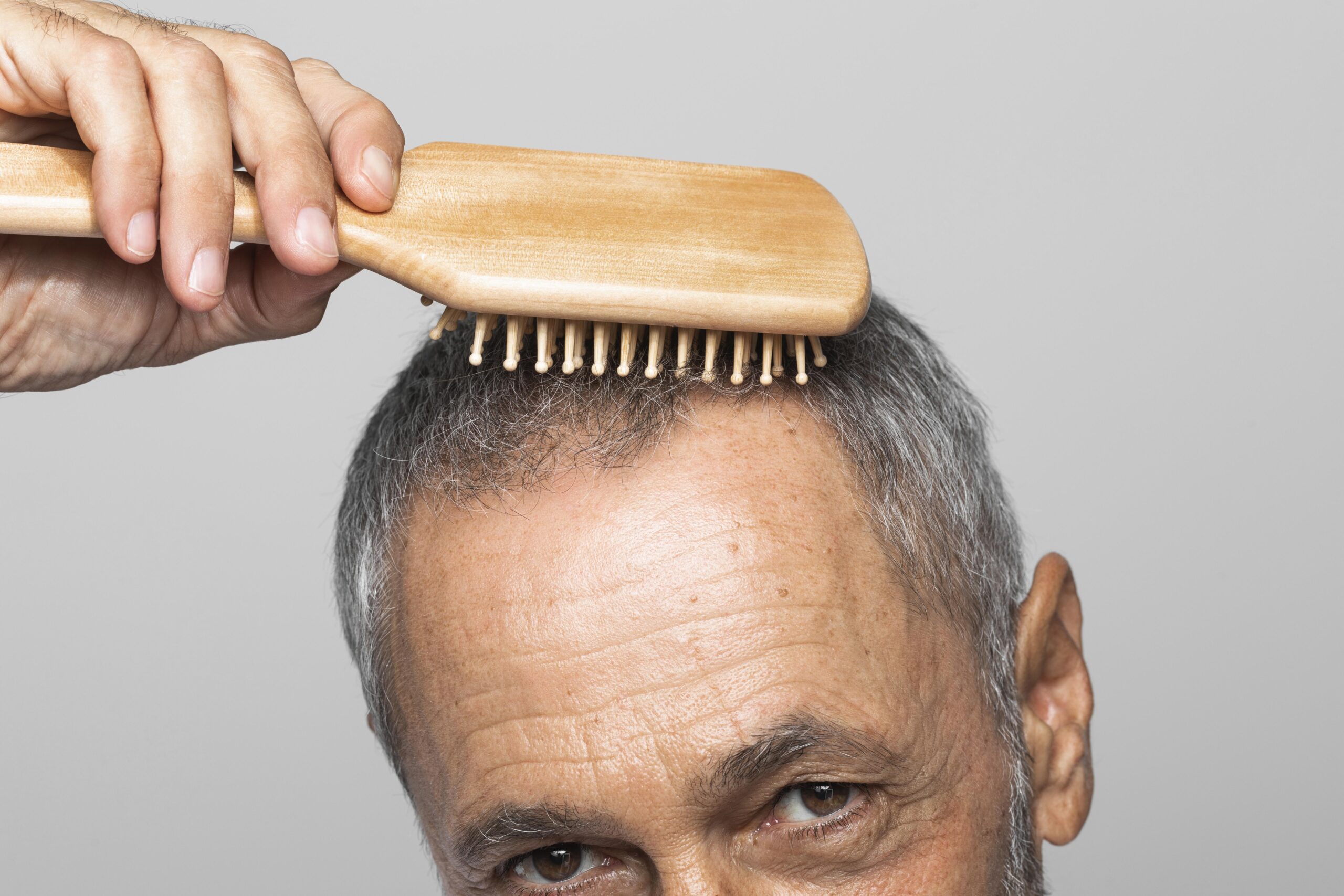 WHY HAIR TURNS GREY: EXPLORING THE SCIENCE BEHIND AGING HAIR